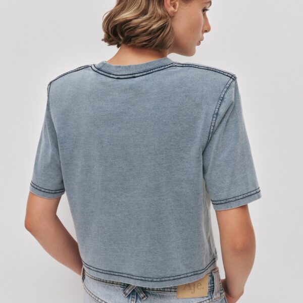 Aje Aus Tops – structured silhouette with raw femininity from Coveti