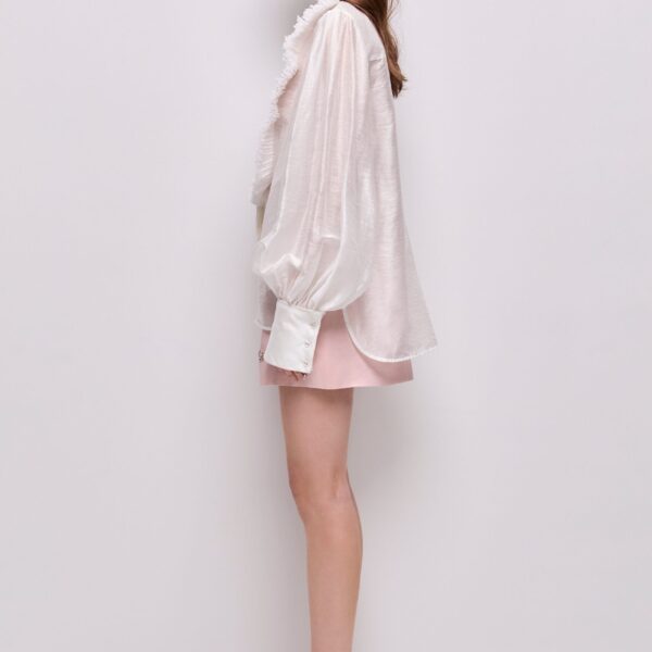 Aje Aus Tops – structured silhouette with raw femininity from Coveti
