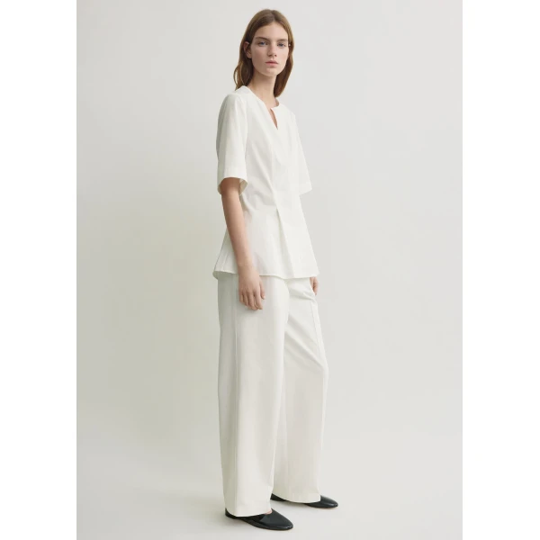 Toteme Tops with minimalist design at Coveti