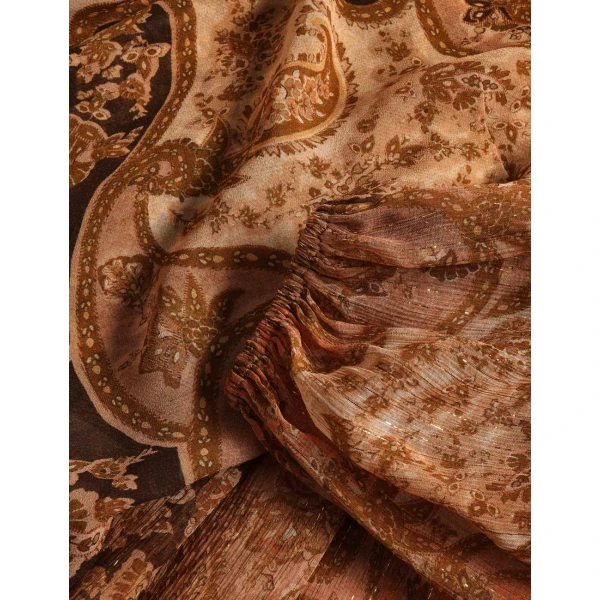 Elevate your elegance in this Zimmermann Tops available now at Coveti