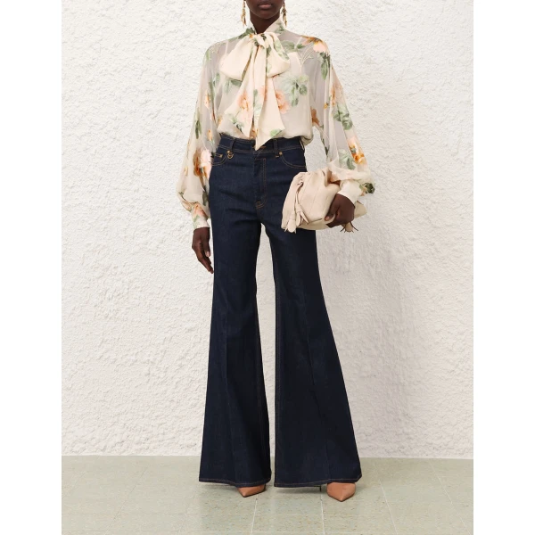 Elevate your elegance in this Zimmermann Tops available now at Coveti