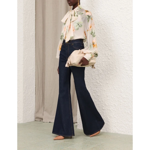 Elevate your elegance in this Zimmermann Tops available now at Coveti