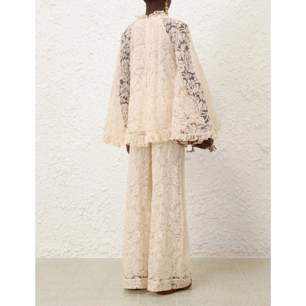 Elevate your elegance in this Zimmermann Tops available now at Coveti