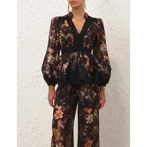 Elevate your elegance in this Zimmermann Tops available now at Coveti
