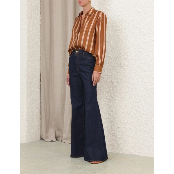 Elevate your elegance in this Zimmermann Tops available now at Coveti