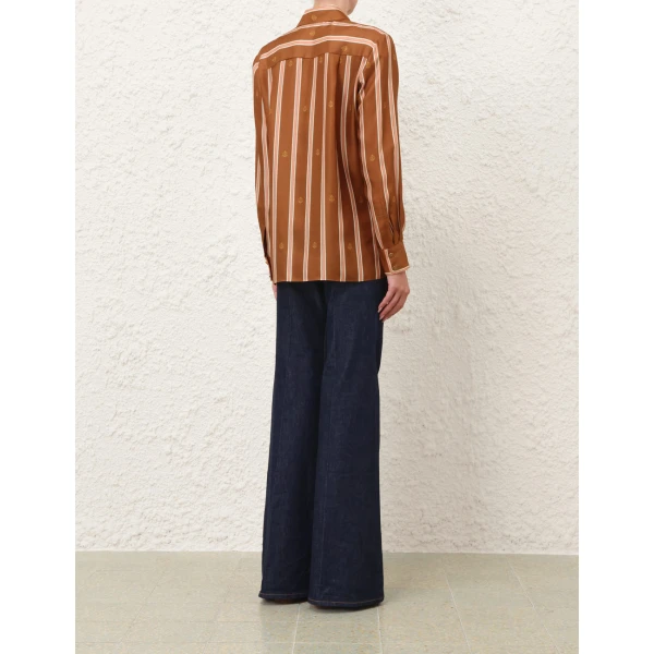 Elevate your elegance in this Zimmermann Tops available now at Coveti