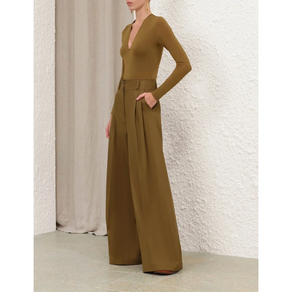 Elevate your elegance in this Zimmermann Bodysuit available now at Coveti