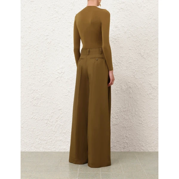 Elevate your elegance in this Zimmermann Bodysuit available now at Coveti