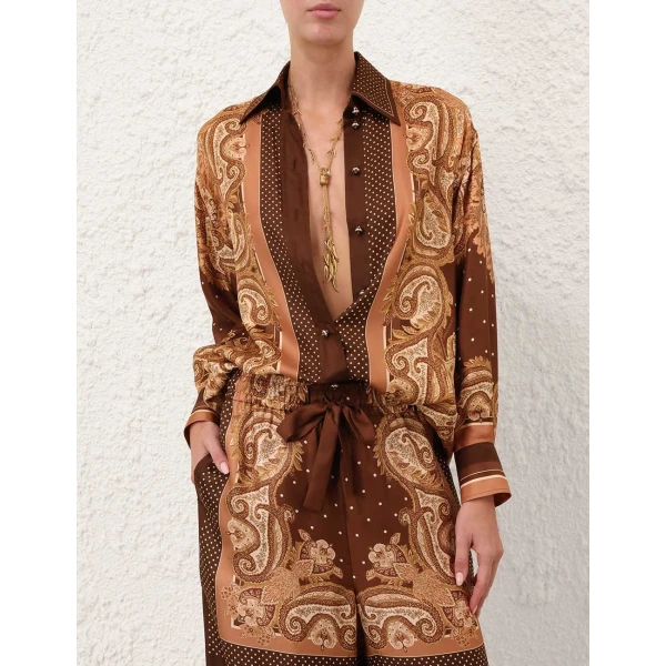 Elevate your elegance in this Zimmermann Tops available now at Coveti