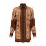 Elevate your elegance in this Zimmermann Tops available now at Coveti
