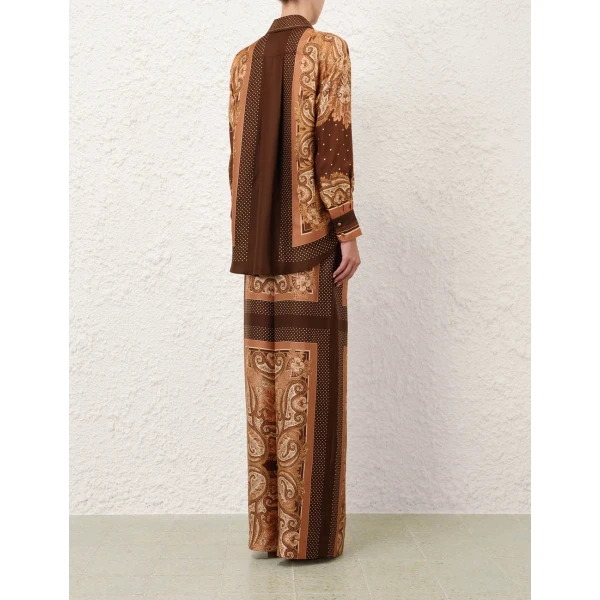Elevate your elegance in this Zimmermann Tops available now at Coveti