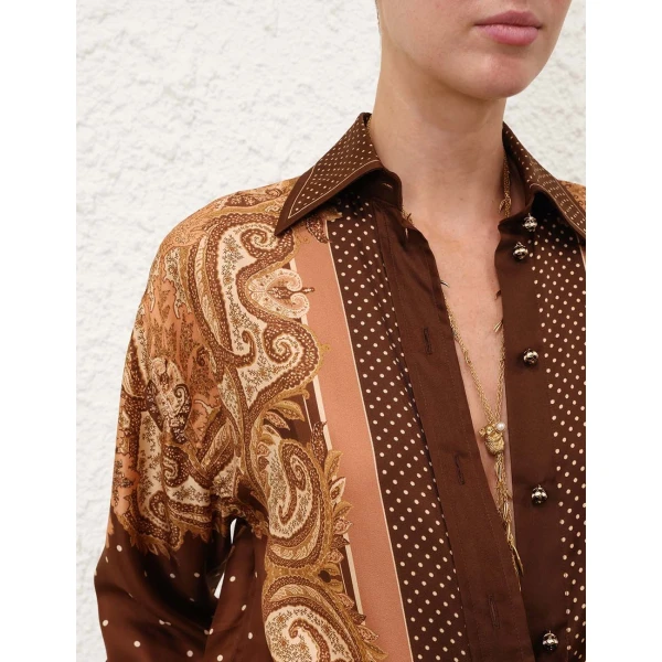 Elevate your elegance in this Zimmermann Tops available now at Coveti