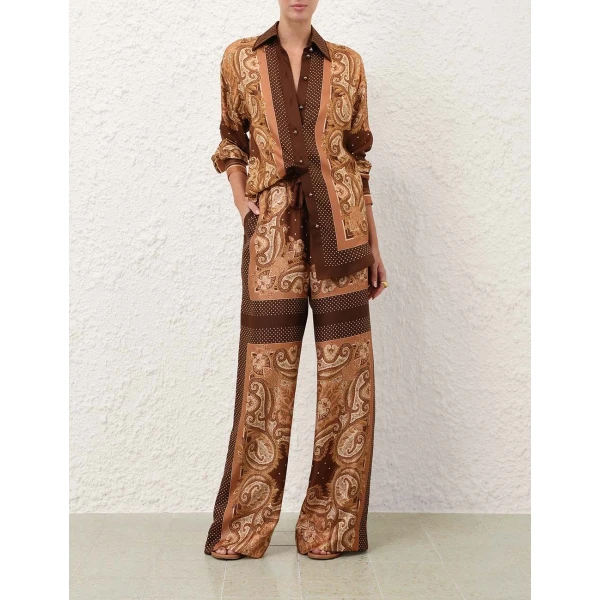 Elevate your elegance in this Zimmermann Tops available now at Coveti