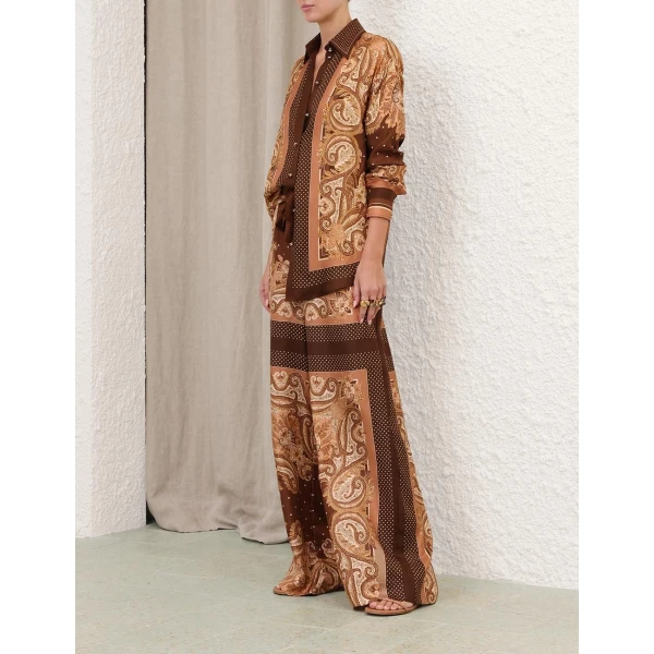 Elevate your elegance in this Zimmermann Tops available now at Coveti