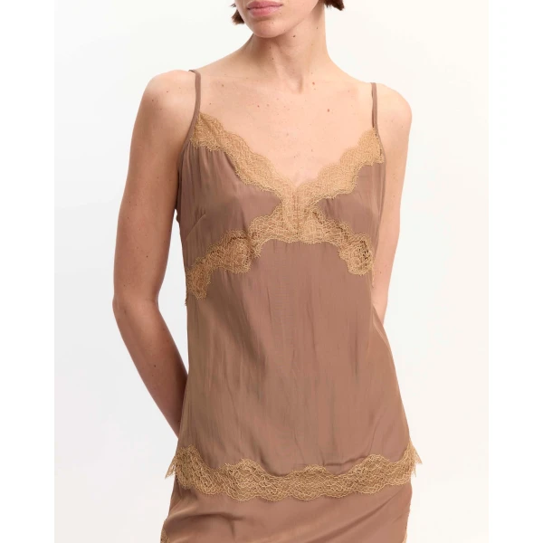 Elevate your elegance in this 16Arlington Tops from the luxury feather dress edit
