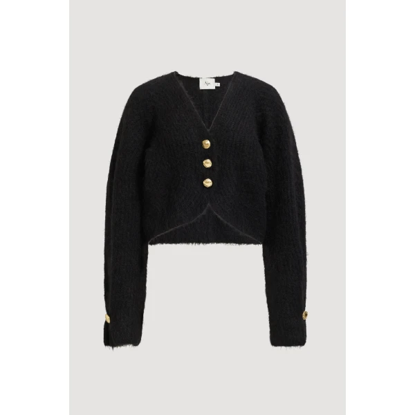 Aje clothing Aus Knitwear – structured silhouette with raw femininity from Coveti