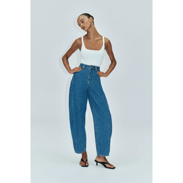 Aje clothing Aus Pants – structured silhouette with raw femininity from Coveti