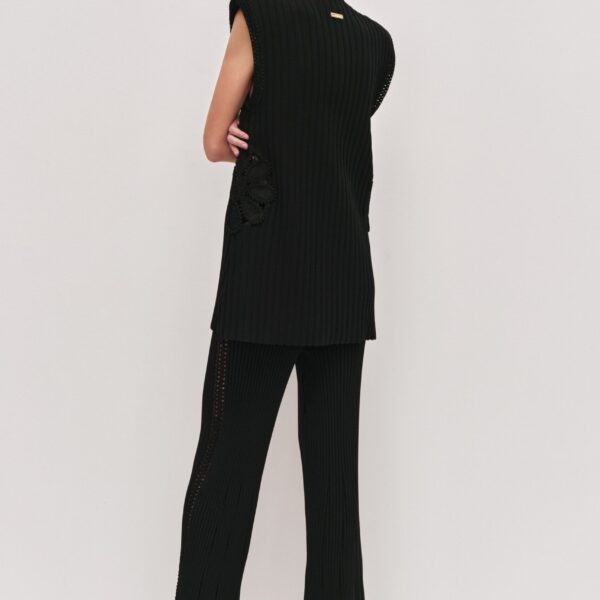 Aje Aus Tops – structured silhouette with raw femininity from Coveti