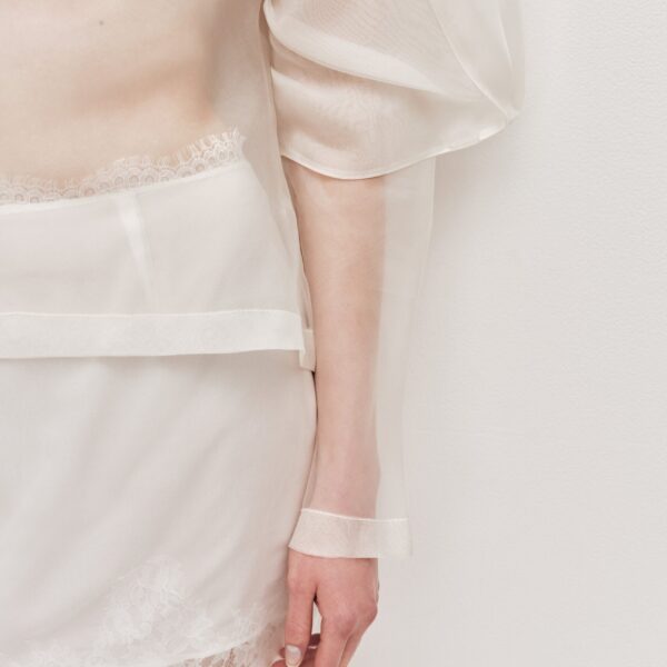 Aje Aus Tops – structured silhouette with raw femininity from Coveti