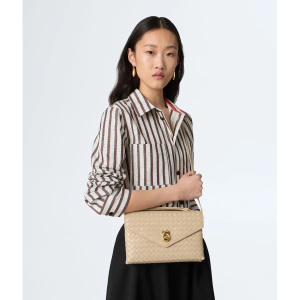 Khaite Women's Knot Lock in Ecru - Beige Clutch Bags - The Lotus Tote Bag - Shop at Coveti