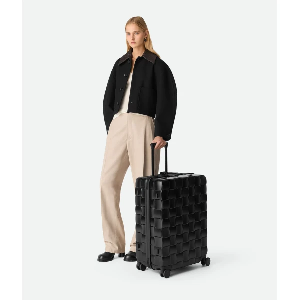 Khaite Odissey Check-In Suitcase in Black - Black  - The Lotus Tote Bag - Shop at Coveti