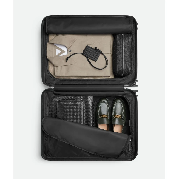 Khaite Odissey Check-In Suitcase in Black - Black  - The Lotus Tote Bag - Shop at Coveti