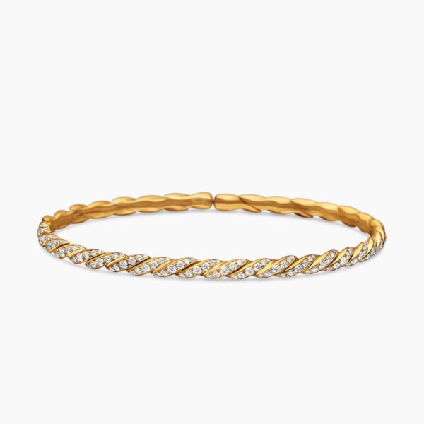 on-model styling shot|David Yurman Sculpted Cable Flex Bracelet in 18K Yellow Gold with Diamonds