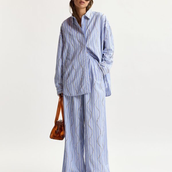 Essentiel Antwerp Light Blue And White Striped Oversized Shirt With Stud Embellishments - Essentiel Antwerp Tops - Colorful Belgian Design - Shop at Coveti