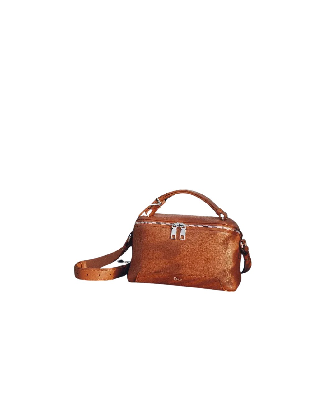 Investment wardrobe pieces — a tailored coat, cashmere knit and leather bag laid flat, for Coveti