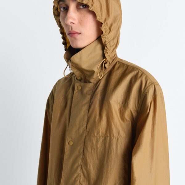 Lemaire Hooded Raincoat in Light Nylon - Coats - Parisian Minimalist Luxury at Coveti