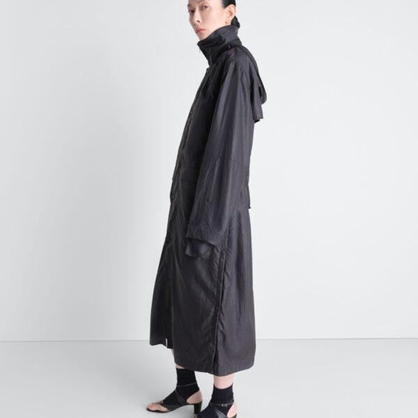 Lemaire Hooded Raincoat in Light Nylon - Coats - Parisian Minimalist Luxury at Coveti