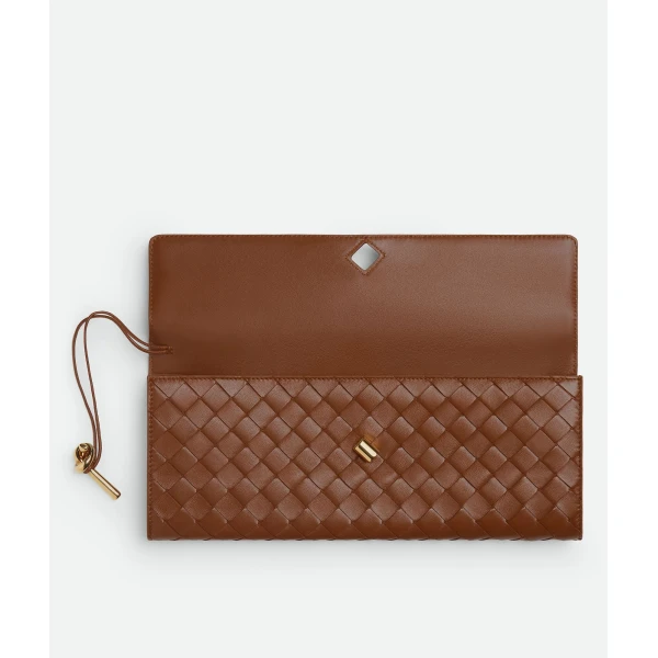 Khaite Women's Andiamo Clutch in Amber - Orange Clutch Bags - The Lotus Tote Bag - Shop at Coveti