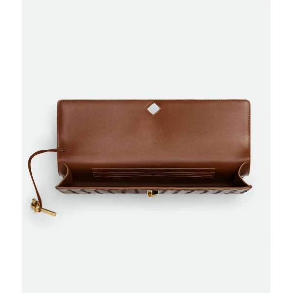 Khaite Women's Andiamo Clutch in Amber - Orange Clutch Bags - The Lotus Tote Bag - Shop at Coveti
