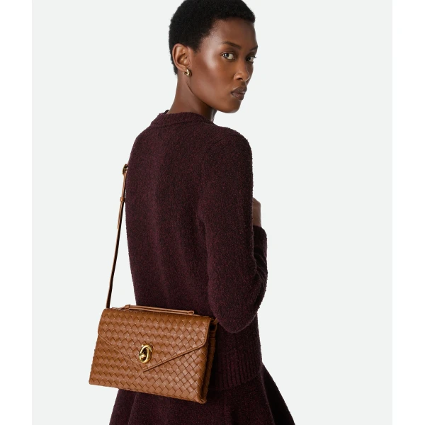 Khaite Women's Knot Lock in Amber - Orange Clutch Bags - The Lotus Tote Bag - Shop at Coveti