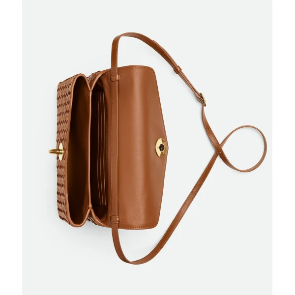 Khaite Women's Knot Lock in Amber - Orange Clutch Bags - The Lotus Tote Bag - Shop at Coveti