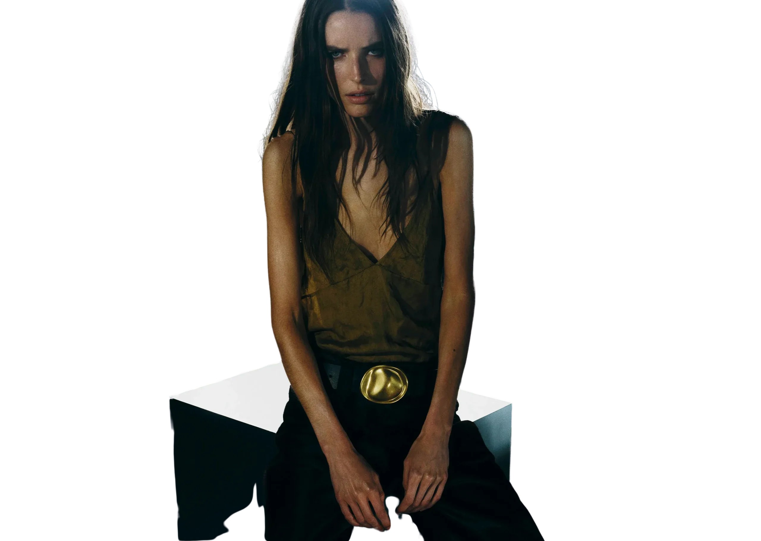 Quiet luxury outfit — camel coat, cashmere knit and tailored trousers, photographed for Coveti