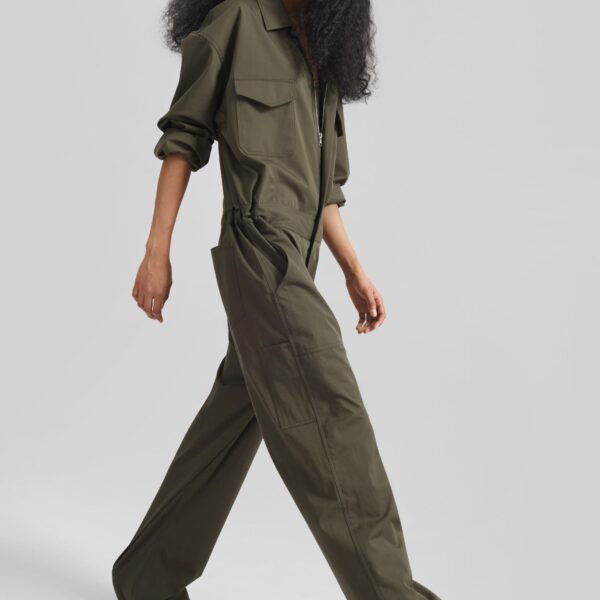 The Frankie Shop Ardea Cotton Utility Jumpsuit - Dark Olive - Oversized Minimalist Jumpsuit in Green - Shop at Coveti