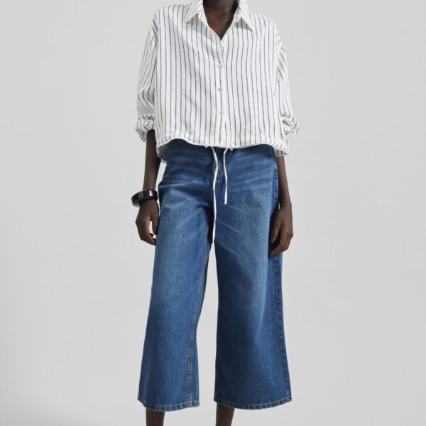 The Frankie Shop Besdon Denim Culottes - Medium Wash - Oversized Minimalist Pants in Grey - Shop at Coveti