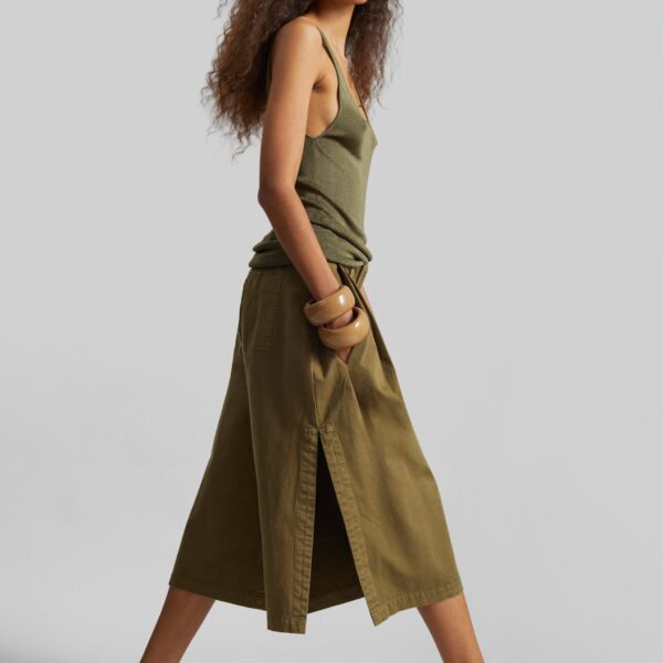 The Frankie Shop Garment Dye Pleated Culotte - Avocado - Oversized Minimalist Shorts in Green - Shop at Coveti