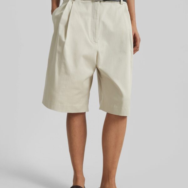 The Frankie Shop Marfa Cotton Pleated Bermuda - Light Beige - Oversized Minimalist Shorts in Beige - Shop at Coveti