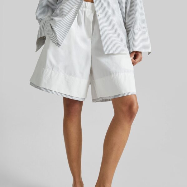 The Frankie Shop Menton Layered Hem Shorts - White/Blue Stripe - Oversized Minimalist Shorts in Multicolour - Shop at Coveti