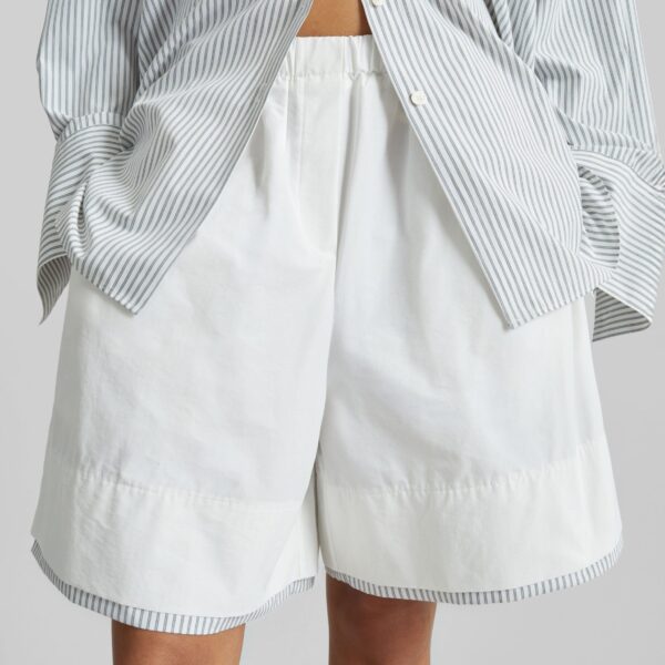 The Frankie Shop Menton Layered Hem Shorts - White/Blue Stripe - Oversized Minimalist Shorts in Multicolour - Shop at Coveti