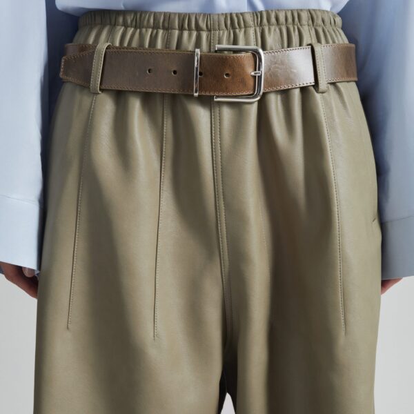 The Frankie Shop Oakdale Faux Leather Track Pants - Sage - Oversized Minimalist Pants in Green - Shop at Coveti