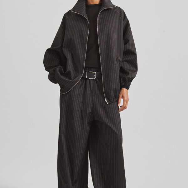 The Frankie Shop Oakdale Track Pants - Black/White Pinstripe - Oversized Minimalist Pants in Multicolour - Shop at Coveti