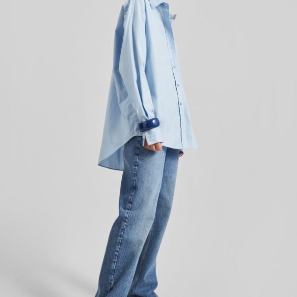 The Frankie Shop Ornella Side Button-Up Shirt - Light Blue - Oversized Minimalist Tops in Blue - Shop at Coveti