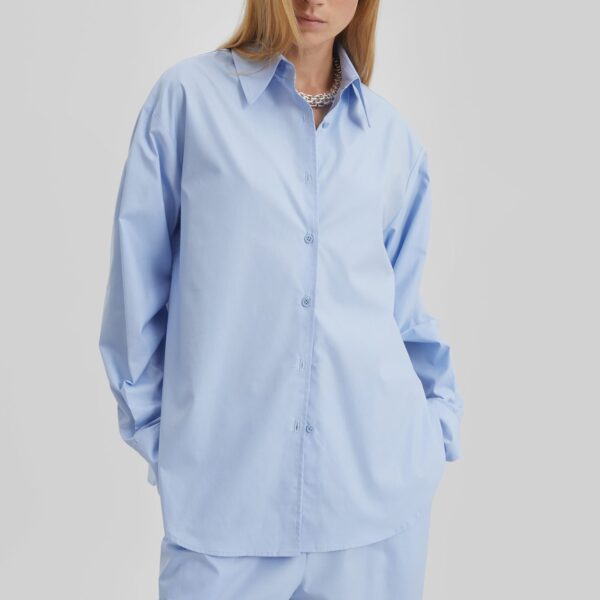 The Frankie Shop Peri Cotton Shirt - Light Blue - Oversized Minimalist Tops in Blue - Shop at Coveti