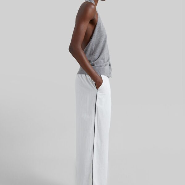 The Frankie Shop Porto Contrast Piped Pants - White/Black Stripe - Oversized Minimalist Pants in Multicolour - Shop at Coveti