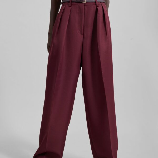 The Frankie Shop Tansy Pleated Trousers - Burgundy - Oversized Minimalist Pants in Red - Shop at Coveti