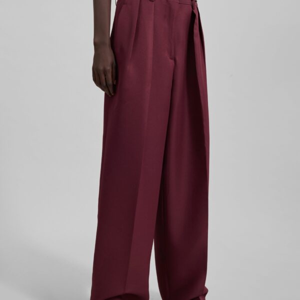 The Frankie Shop Tansy Pleated Trousers - Burgundy - Oversized Minimalist Pants in Red - Shop at Coveti