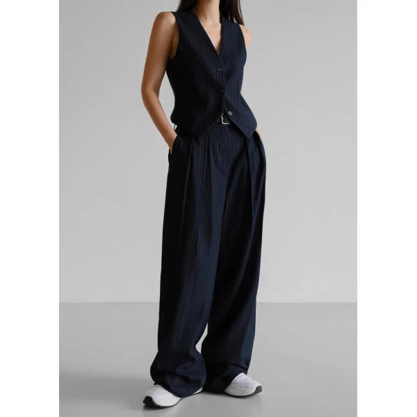 The Frankie Shop Tansy Pleated Trousers - Navy Pinstripe - Oversized Minimalist Pants in Multicolour - Shop at Coveti